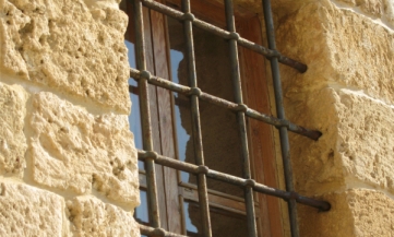 An image of a prison window with bars